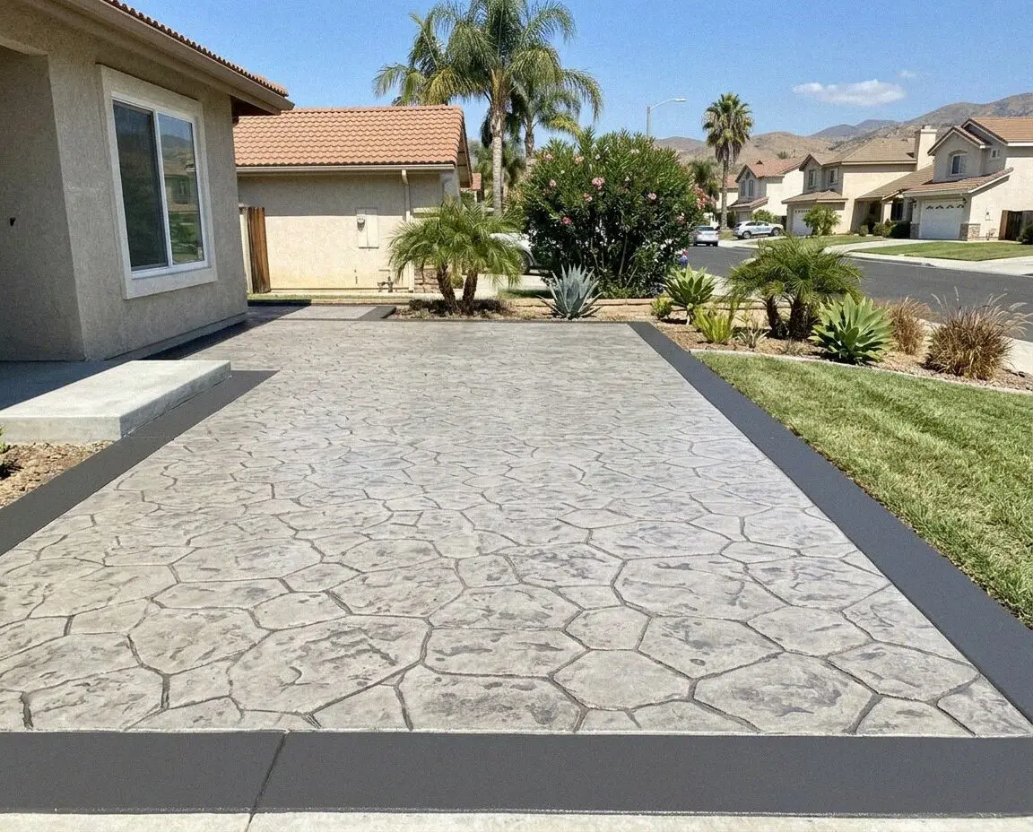 Ashlar slate stamped concrete patio behind a West Covina residence